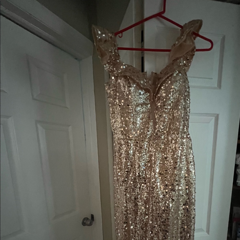 Beautiful gold sequin dress with split. Perfect for a wedding or a special event